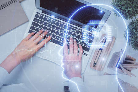 Double exposure of woman working on computer andhuman brain hologram drawing. Top View. Ai concept.