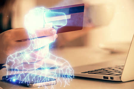 Multi exposure of woman on-line shopping holding a credit card and man in AR glasses drawing. E-learning concept.の写真素材