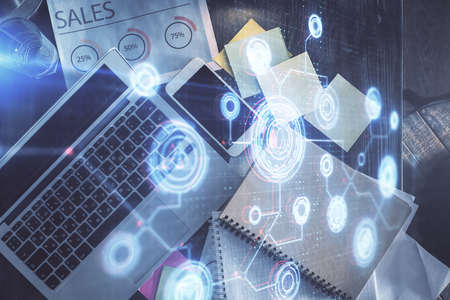 Multi exposure of data theme drawing hologram over topview work desk background with computer....