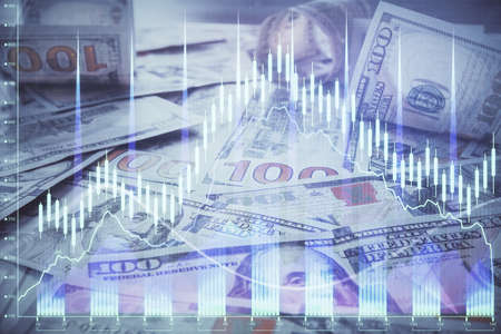 Multi exposure of forex chart drawing over us dollars bill background. Concept of financial success...
