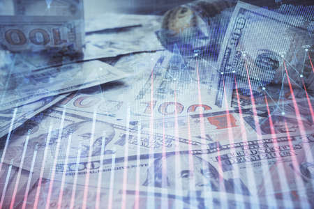 Multi exposure of forex chart drawing over us dollars bill background. Concept of financial success markets.の写真素材