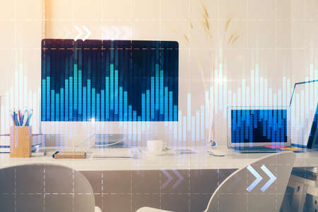 Forex market graph hologram and personal computer on background. Multi exposure. Concept of...
