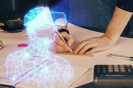 Abstract man wearing augmented reality headsets computer work with writing human background. AR concept. Double exposure.の写真素材