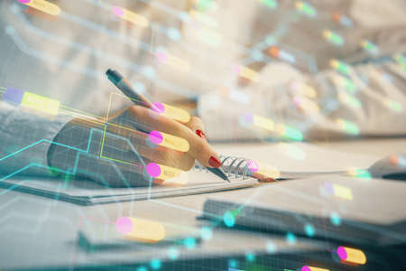 Multi exposure of woman's writing hand on background with data technology hologram. Concept of...