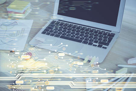 Double exposure of computer and technology theme hologram. Concept of freelance work.