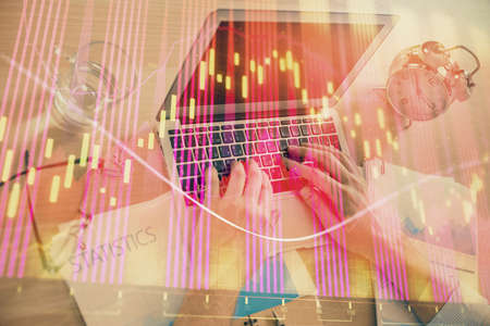 Multi exposure of forex graph with man working on computer on background. Concept of market...