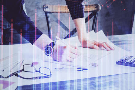 Multi exposure of man standing and planing investment with stock market forex chart background....