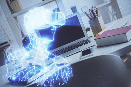 Computer on desktop with AR theme icon. Multi exposure. Concept of augmented reality.の写真素材