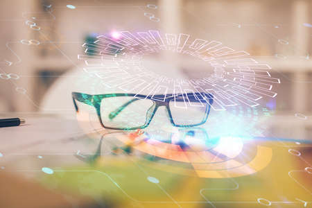 Data tech hologram with glasses on the table background. Concept of technology. Double exposure.の写真素材