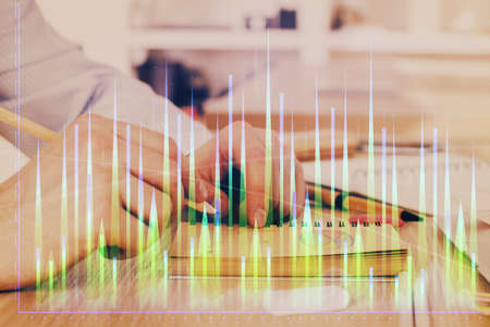 Multi exposure closeup hands with stock market forex graph. Concept of research and analysis.の写真素材