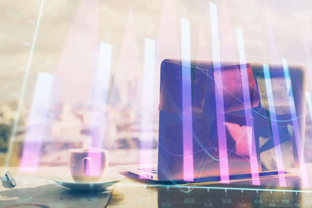 Stock market graph and table with computer background. Multi exposure. Concept of financial analysis.の写真素材