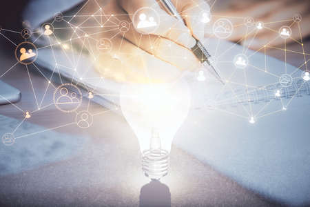 Social network theme hologram over hands taking notes background. Concept of global international people connect. Double exposureの写真素材