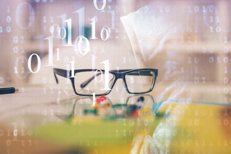 Data tech hologram with glasses on the table background. Concept of technology. Double exposure.の写真素材