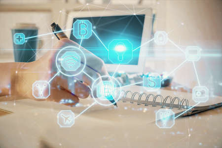 Social network theme hologram over woman's hands writing background. Concept of international people...