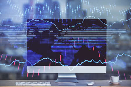 Forex market chart hologram and personal computer background. Double exposure. Concept of...