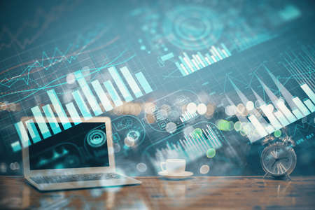 Forex market chart hologram and personal computer background. Double exposure. Concept of...