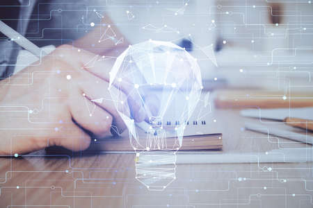 Innovative your business. Idea concept icon on writing man's hand background. Multi exposure.の写真素材