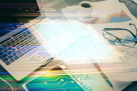 Double exposure of table with computer on background and data theme drawing. Concept of innovation.の写真素材
