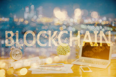 Double exposure of blockchain and crypto economy theme hologram and table with computer background. Concept of bitcoin cryptocurrency.の写真素材