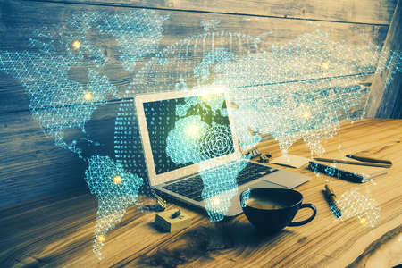 Double exposure of business theme icons and work space with computer background. Concept of success.の写真素材