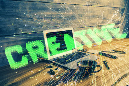 Desktop computer background in office and start up theme hologram drawing. Double exposure. Startup concept.の写真素材