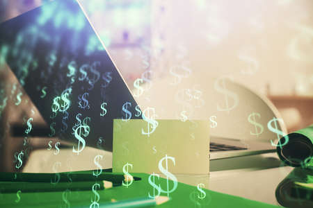 Forex market graph hologram and personal computer on background. Multi exposure. Concept of investment.の写真素材