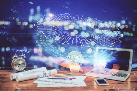 Double exposure of table with computer on background and data theme hologram. Data technology...