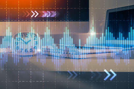 Forex market graph hologram and personal computer on background. Double exposure. Concept of...