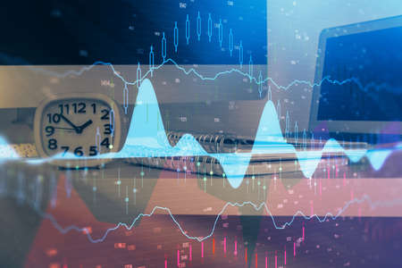 Forex market graph hologram and personal computer on background. Double exposure. Concept of...