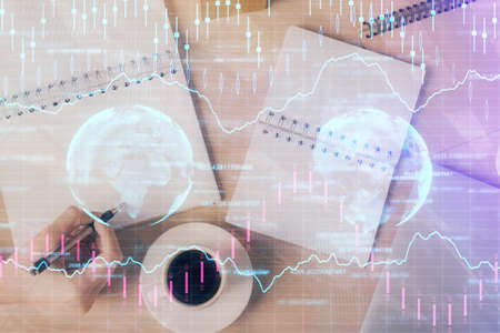 Multi exposure of woman's hands making notes with forex graph hologram. Concept of technical...