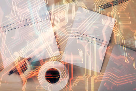 Technology theme hologram over woman's hands taking notes background. Concept of Tech. Double...