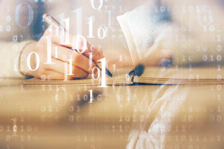Double exposure of writing hand on background with data technology hologram. Big data concept.