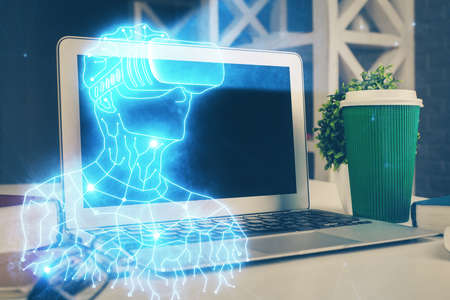 Computer on desktop with AR theme icon. Multi exposure. Concept of augmented reality.