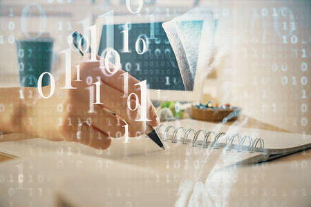 Double exposure of hands making notes with digital coding icons. Computer learning concept.