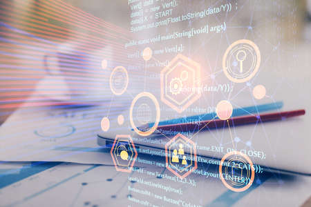 Double exposure of table with computer on background and data theme hologram. Data technology...