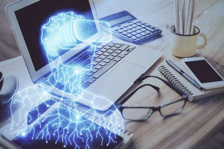 Computer on desktop with AR theme icon. Multi exposure. Concept of augmented reality.の写真素材