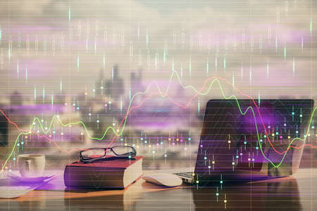Double exposure of financial chart drawings and desk with open notebook background. Concept of forex...