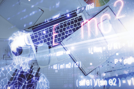 Physics and math theme hologram with formula drawings over computer on the desktop background. Top...