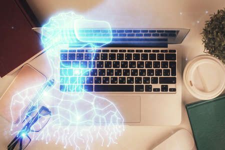 AR hologram drawings over computer on the desktop background. Top view. Multi exposure. Concept of...