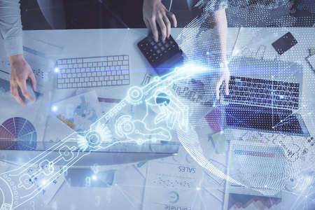 Double exposure of man and woman working together and tech hologram drawing. Technology concept....