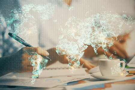 Double exposure of social network theme drawing over people taking notes background. Concept of human connectionの写真素材