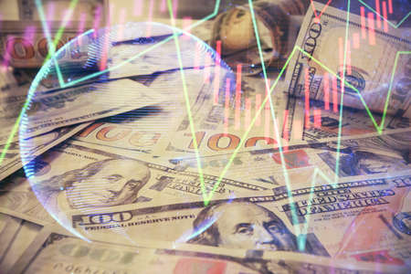 Multi exposure of forex chart drawing over us dollars bill background. Concept of financial success...