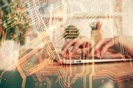 Double exposure of woman hands typing on computer and technology theme drawing. High Tech concept.