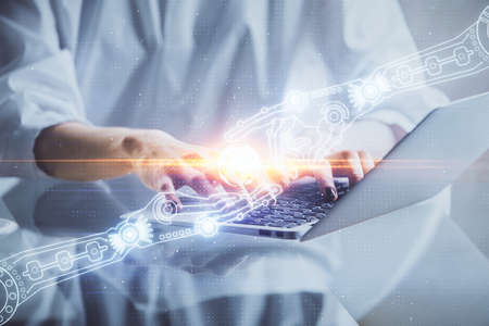 Double exposure of woman hands working on computer and data theme hologram drawing. Tech concept.の写真素材