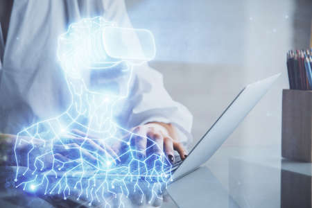 Double exposure of woman hands typing on computer and man in AR glasses drawing. Education concept.
