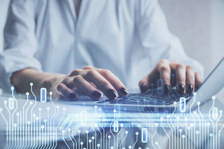 Double exposure of woman hands working on computer and data theme hologram drawing. Tech concept.