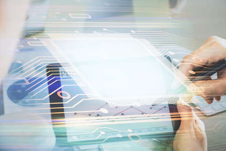 Multi exposure of man's hands holding and using a digital device and data theme drawing. Innovation...