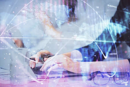 Multi exposure of woman hands typing on computer and business theme hologram drawing. Success...