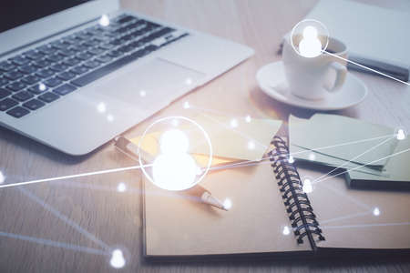 Double exposure of social network drawing and desktop with coffee and items on table background. Concept of international connection.の写真素材