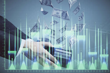 Multi exposure of financial graph drawing hologram and USA dollars bills and man hands. Analysis...